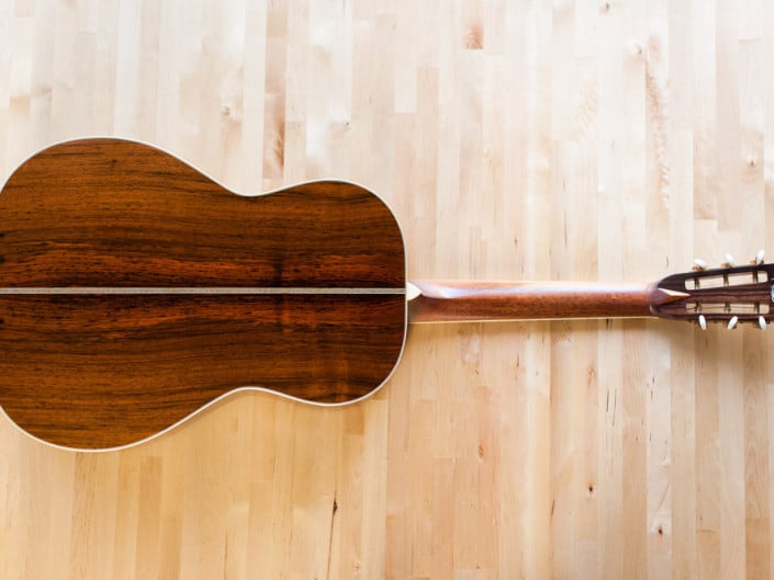 12 Fret 000 acoustic guitar handcrafted from Adirondack Spruce and Brazilian Rosewood. Back wood
