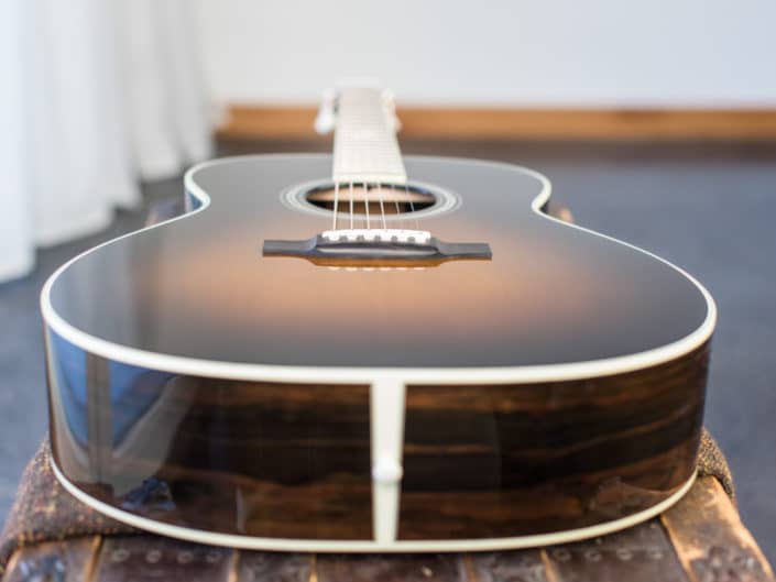 0000 model acoustic guitar