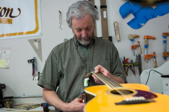 Gareth Jenkins setting up a Preston Thompson acoustic guitar