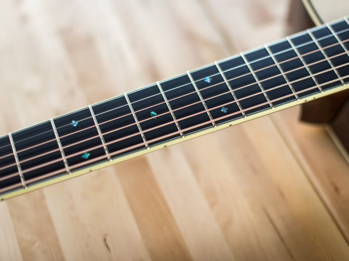 custom inlay om acoustic guitar